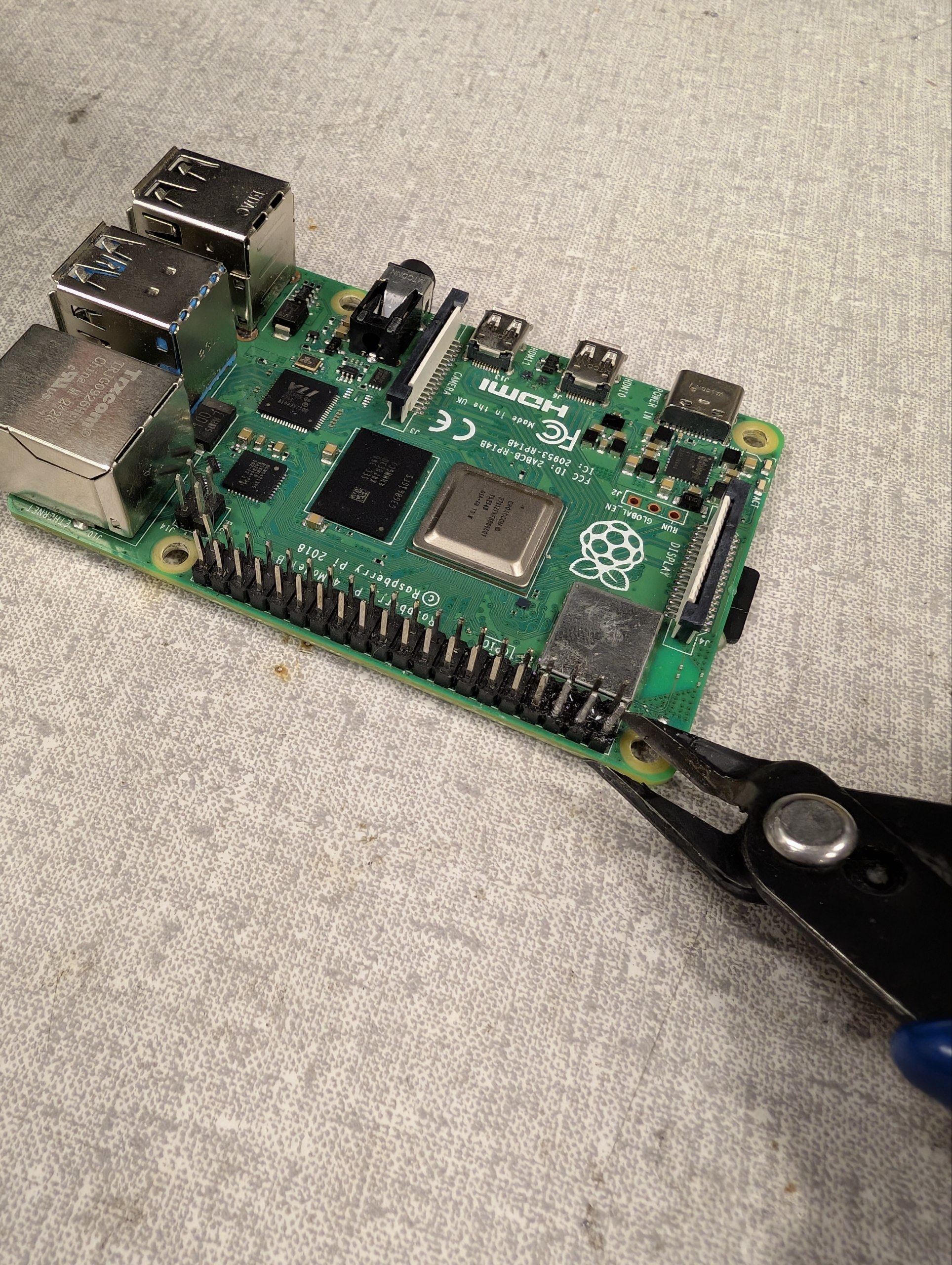 Cutting the pins with wire cutters